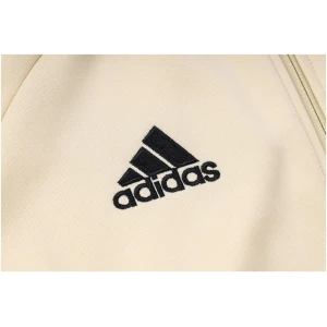 Survêtement d'entraînement Manchester United : Veste à capuche et pantalon crème 2023/24
